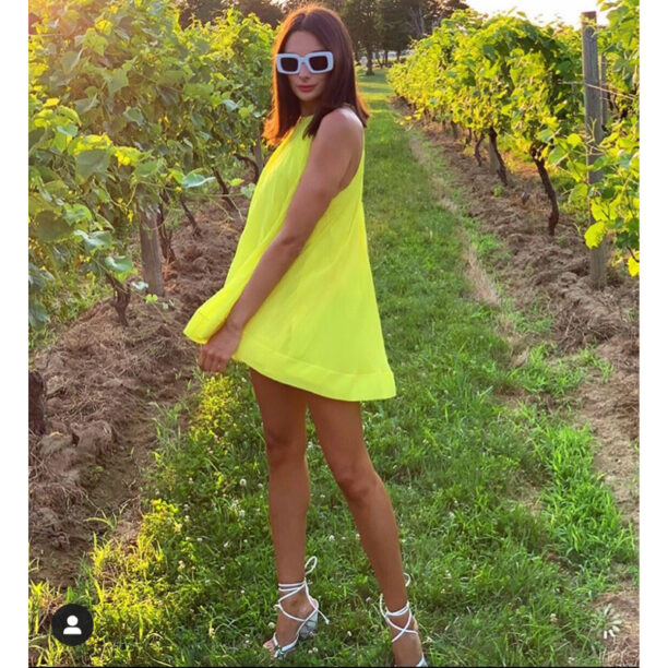 Paige Desorbo’s Yellow Pleated Halter Dress 