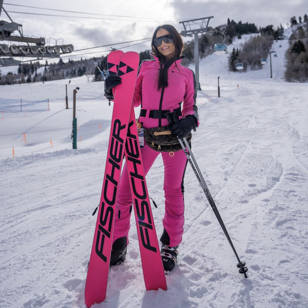 https://www.bigblondehair.com/wp-content/uploads/2022/12/Lisa-Barlows-Pink-Ski-Suit.png