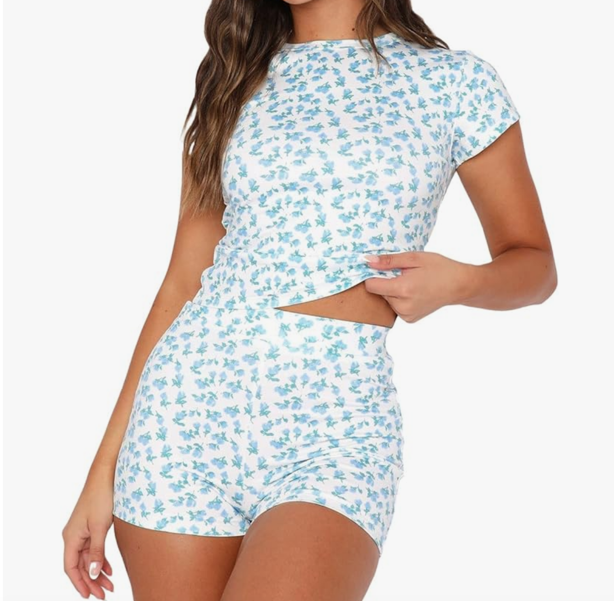 https://www.bigblondehair.com/wp-content/uploads/2023/12/Madison-LeCroys-White-and-Blue-Floral-Pajama-Set-2-e1702649551667.png