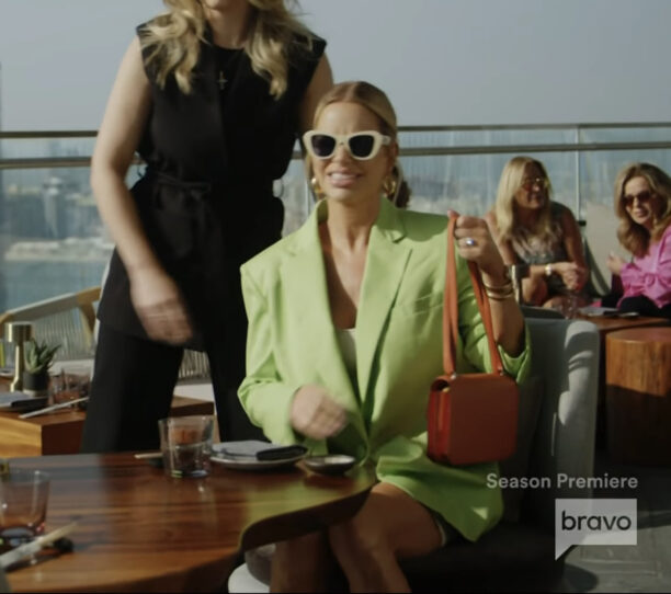 Caroline Stanbury's Green Blazer and White Sunglasses