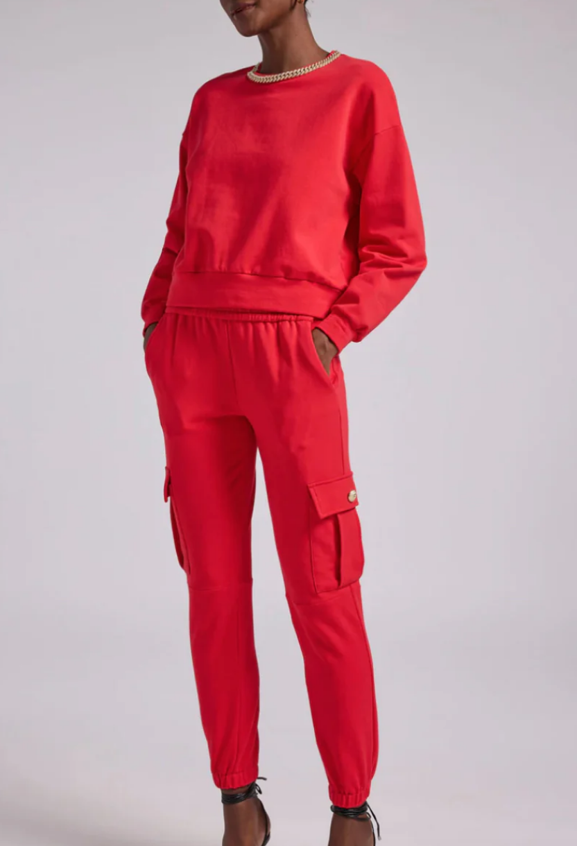 Jenn Fessler's Red Chain Embellished Sweatshirt